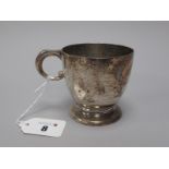 A Hallmarked Silver Mug, Wakely & Wheeler, London 1943, of plain form with loop handle (160grams).