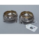 A Pair of Victorian Hallmarked Silver Salts, (marks rubbed), with foliate decoration, raised on
