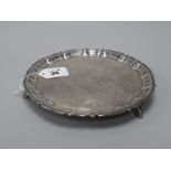 A Hallmarked Silver Waiter, Messrs Hutton, Sheffield 1922, of shaped circular form, raised on