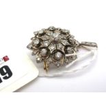 A Highly Attractive Victorian Diamond Set Pendant / Brooch, of cluster design with pierced detail,