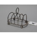 A Hallmarked Silver Five Bar Toast Rack, SWS&Co, Birmingham 1920, on four ball feet (70grams).