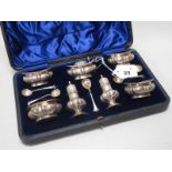 A Hallmarked Silver Seven Piece Cruet Set, (marks rubbed), complete with a set of five hallmarked