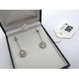 A Pair of Diamond Set Drop Earrings, each flowerhead cluster millegrain set with brilliant cut