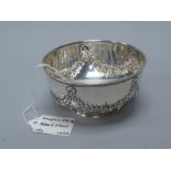A Hallmarked Silver Bowl, Stokes & Ireland, Birmingham 1895, of circular form with rose swags