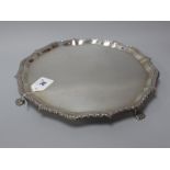 A Hallmarked Silver Salver, EJH NH, London 1903, of shaped design, raised on four paw feet, 31cm