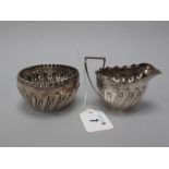 A Victorian Hallmarked Silver Jug and Sugar Bowl, GMJ, London 1888, each of semi gadrooned form,