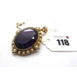 A Large Victorian Single Stone Amethyst Pendant / Brooch, oval collet set within border of half