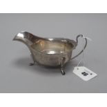 A Hallmarked Silver Sauce Boat, EV, Sheffield 1948, with wavy cut edge, raised on three pad feet (