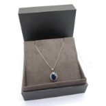 Clogau; A Modern Sapphire and Diamond Pendant, oval four claw set within border of brilliant cut