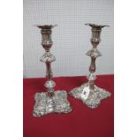 A Pair of Hallmarked Silver Candlesticks, JR, Sheffield 1905, each of shaped design, with