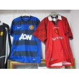 Manchester United Umbro Home Shirt, bearing 'Sharp' logo, size L. Nike blue away shirt bearing '