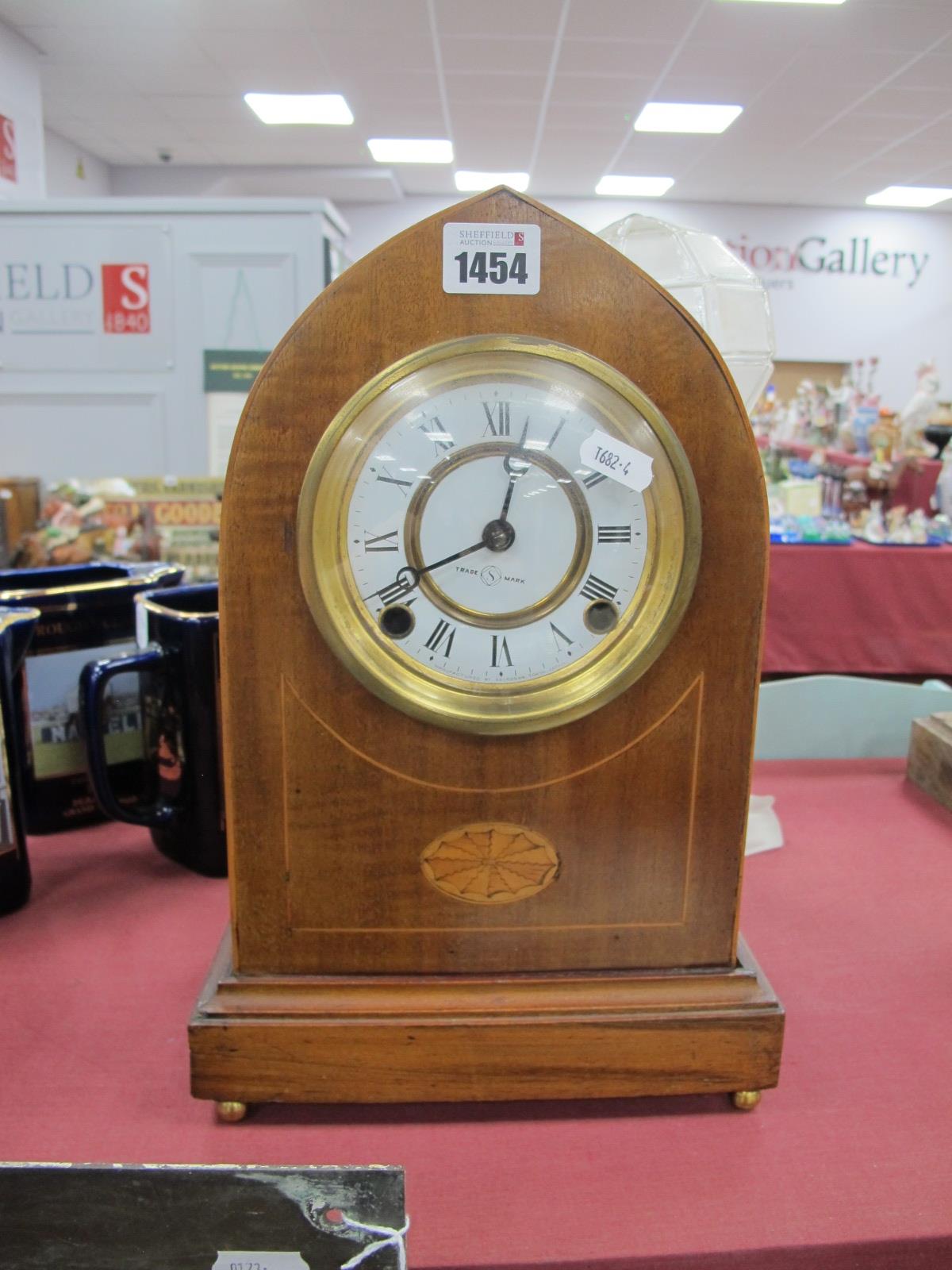 An Edwardian Inlaid Mantle Clock, 'Seikosha' movement, white enamel dial, with Roman numerals.