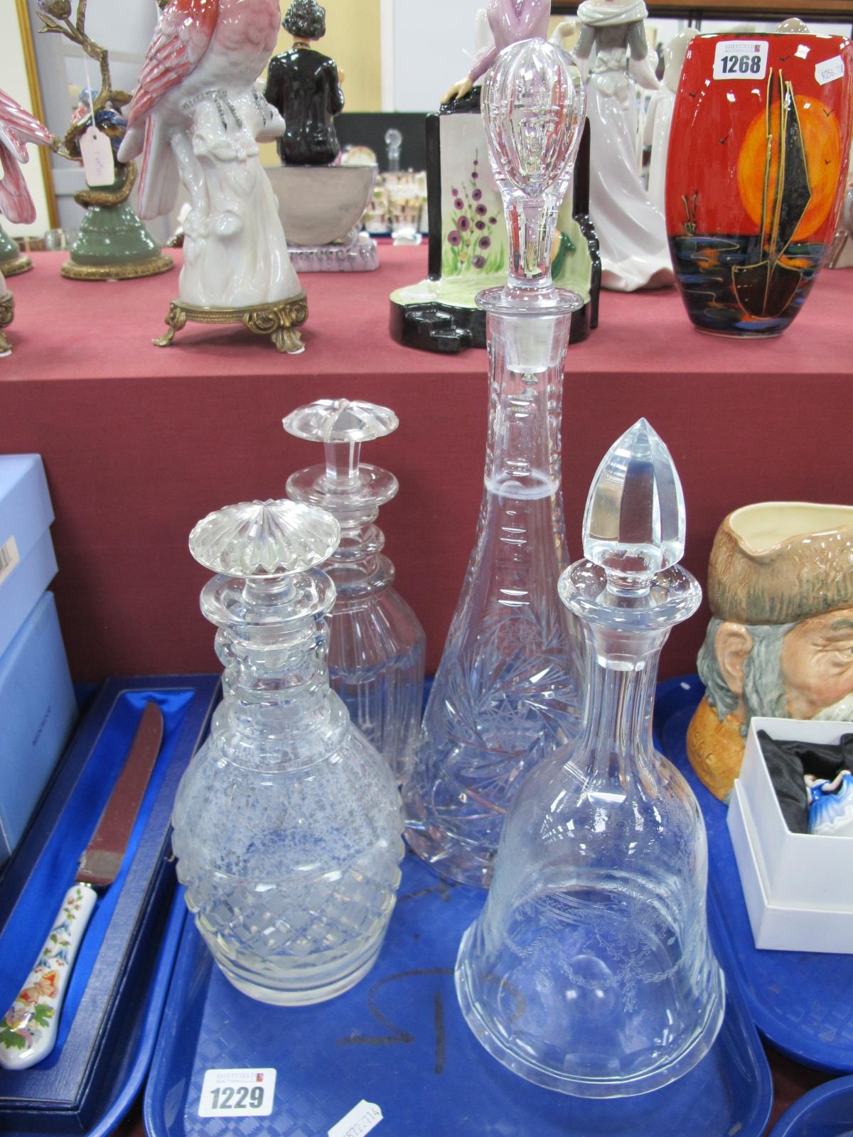 Four Glass Decanters, conical, bell and mallet shaped, the tallest 38cm (4).