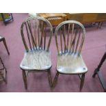 A Pair of Early XX Century Ash Elm Hoop Back Chairs, with spindle supports, one stamped Haines, High