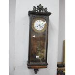 Viennese Wall Clock, slender with allover carving, eight day movement, black Roman numerals, white