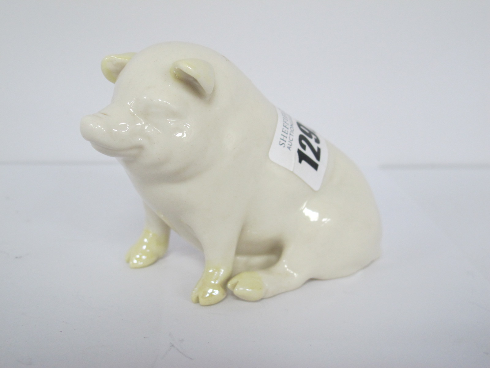 Belleek Pig, with green back stamp,sitting 8cm.