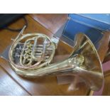 A John Packer JP 161 The Hornblower French Horn, in brass (damages).