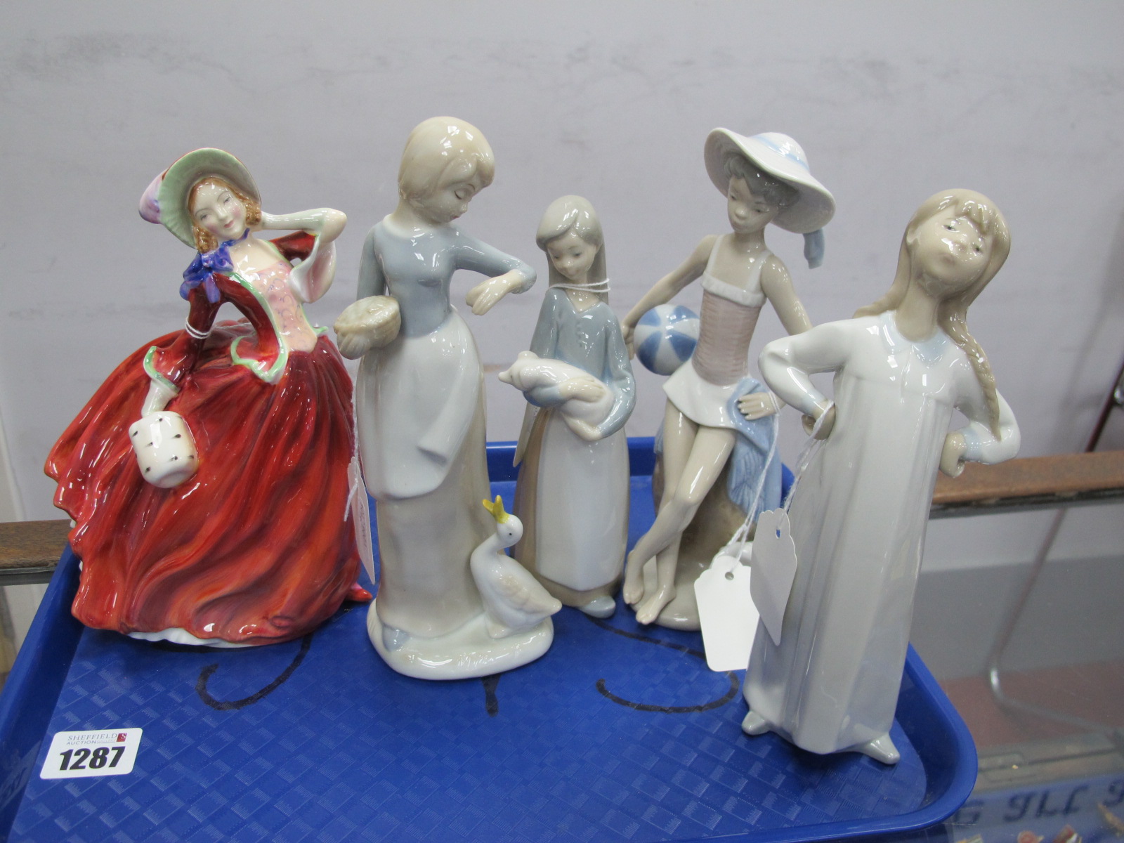 Lladro Figures of a Beach Girl, 20cm high and girl holding a lamb, two unstamped examples and