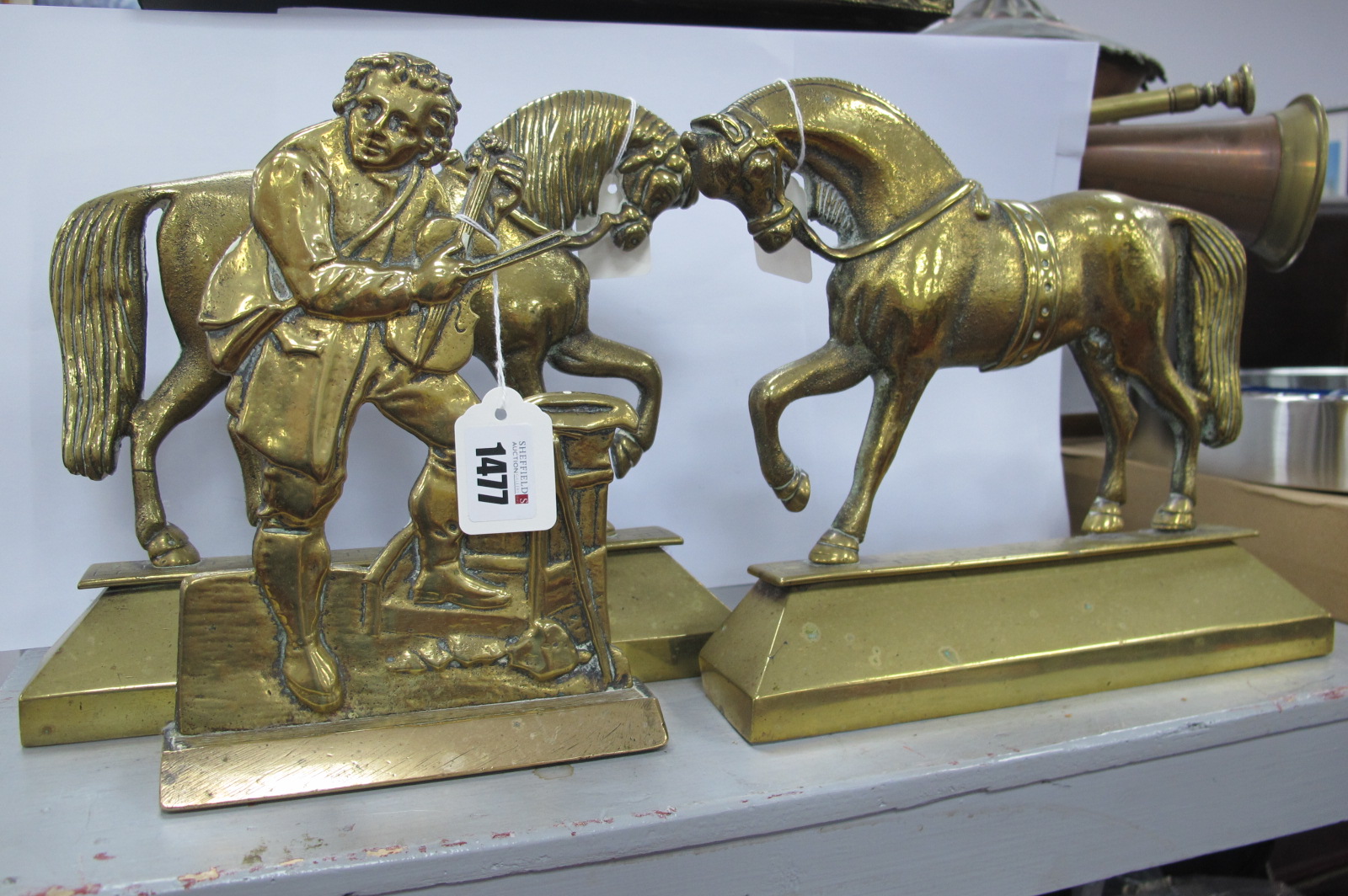 XIX Century pair of Brass Horse Doorstop's, together with one other doorstop of a man playing the