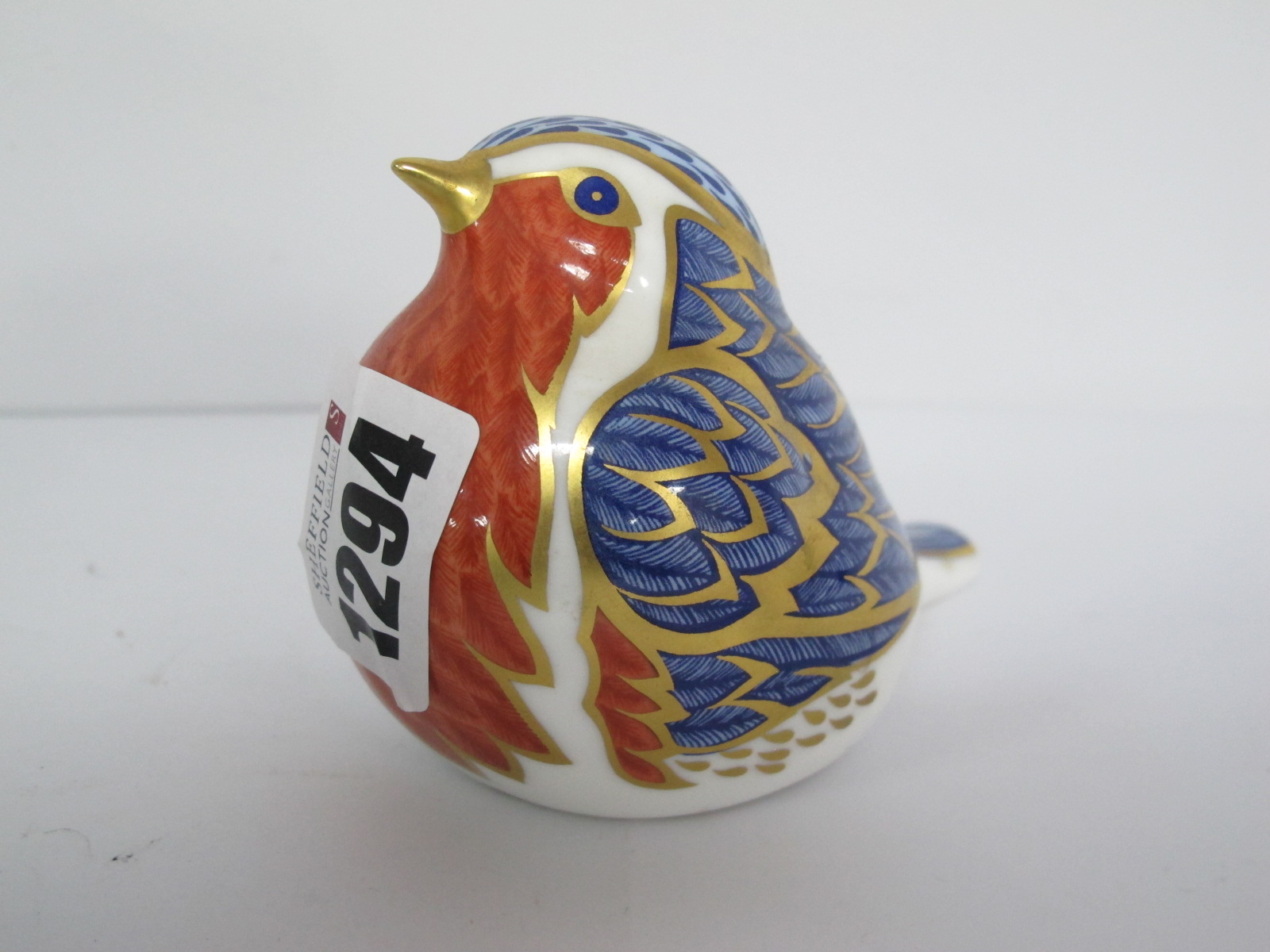 A Royal Crown Derby Paperweight, 'Robin' with a silver stopper.