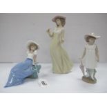 Three Nao Figurines, Autumn Showers, Girl Holding a Flower, Girl Sat on Rocks, (plus boxes). (3)
