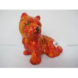 An Anita Harris Westie Seated Dog, gold signed, 15cm high, 15cm wide.