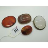 Polished Hardstone and Other Panel Brooches. (4)