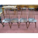 A Set of Four Ercol Dark Stained Dining Chairs, with a shaped top rail, rail supports, circular