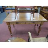 A XIX Century Pitch Pine Library Table, with a rectangular top, moulded edge, two small drawers,