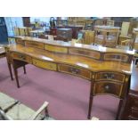 A Regency Style Mahogany Sideboard, serpentine fronted with faux drawer gallery, end cupboards