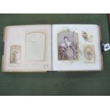 An Early XX Century Photograph Album, with green leather cover, containing several period portrait
