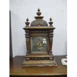 A Late XIX Century Walnut Mantel Clock, with turned finial's, arched top, square dial, Roman