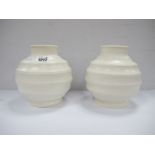 Keith Murray (1892 - 1981) For Wedgwood, Art Deco white globular pottery vases, bomb design, green