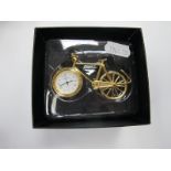 A Novelty Quartz Clock in the form of a Push Bike, boxed.