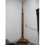 a 1920's Walnut Art Deco Standard Lamp, with a moulded pedestal circular base, on four block