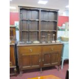 An Early XX Century Oak Dresser, the top with four shelves, base with two drawers over panelled