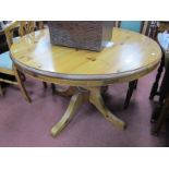 Pine Extending Pedestal Table, with a circular top, bulbous pedestal table, on shaped legs.