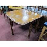 A XX Century Oak Drop Leaf Table, on shaped reeded legs.