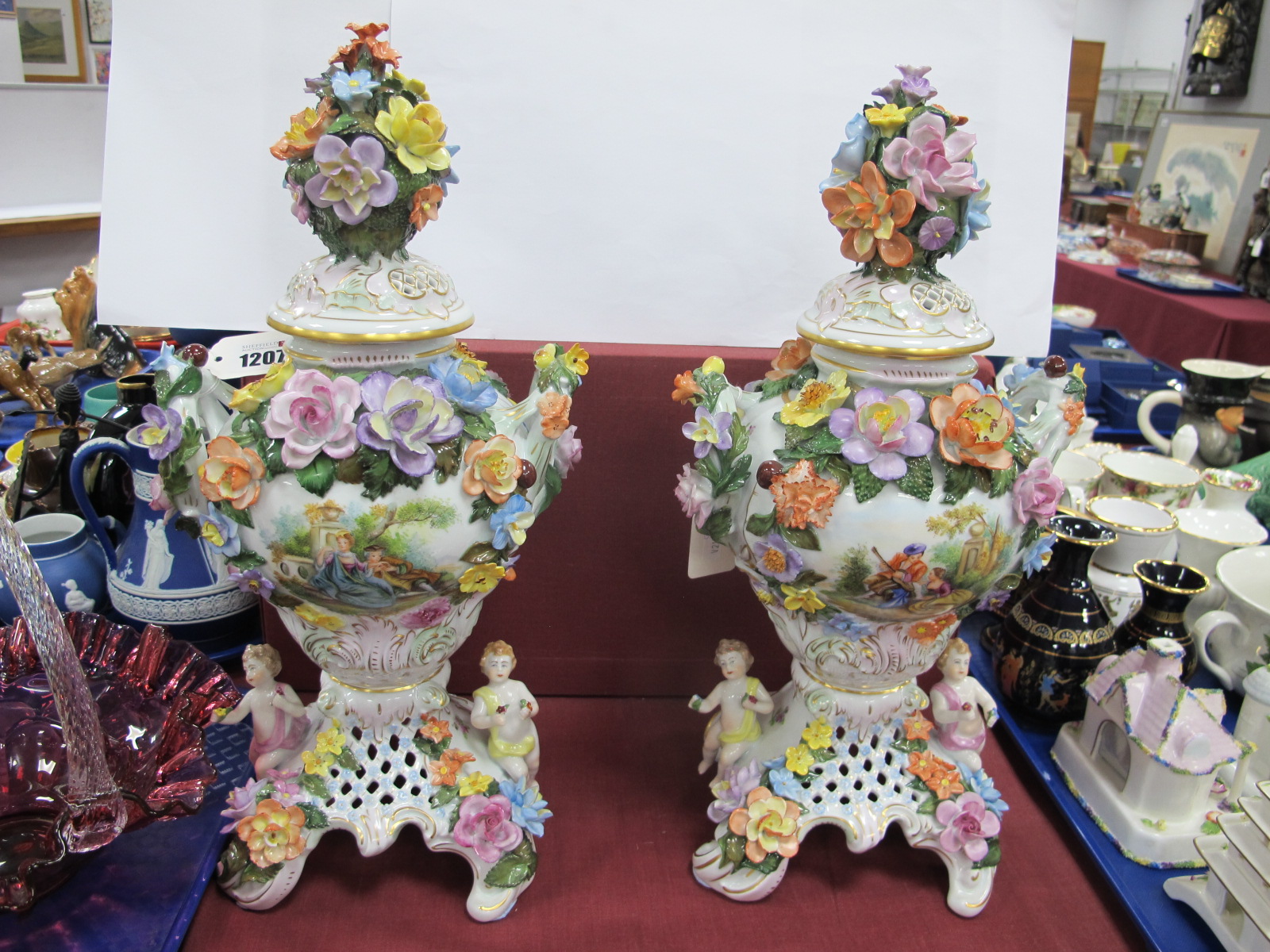 A Pair of Dresden Mid to Late XX Century Ceramic Urn Vases, each with hand painted Regency