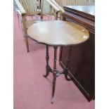 An Edwardian Mahogany Occasional Table, with crossbanded top on turned supports and shaped feet (