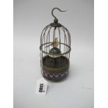 A Mechanical Clock in the form of a Bird in a Cage, 21cm high.