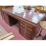 A Chinese Hardwood Pedestal Desk, with brushing slides, central drawers, flanking pedestals, with