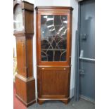 An XVIII Century Style Mahogany Double Corner Cupboard, with a dentil cornice, glazed astragal door,