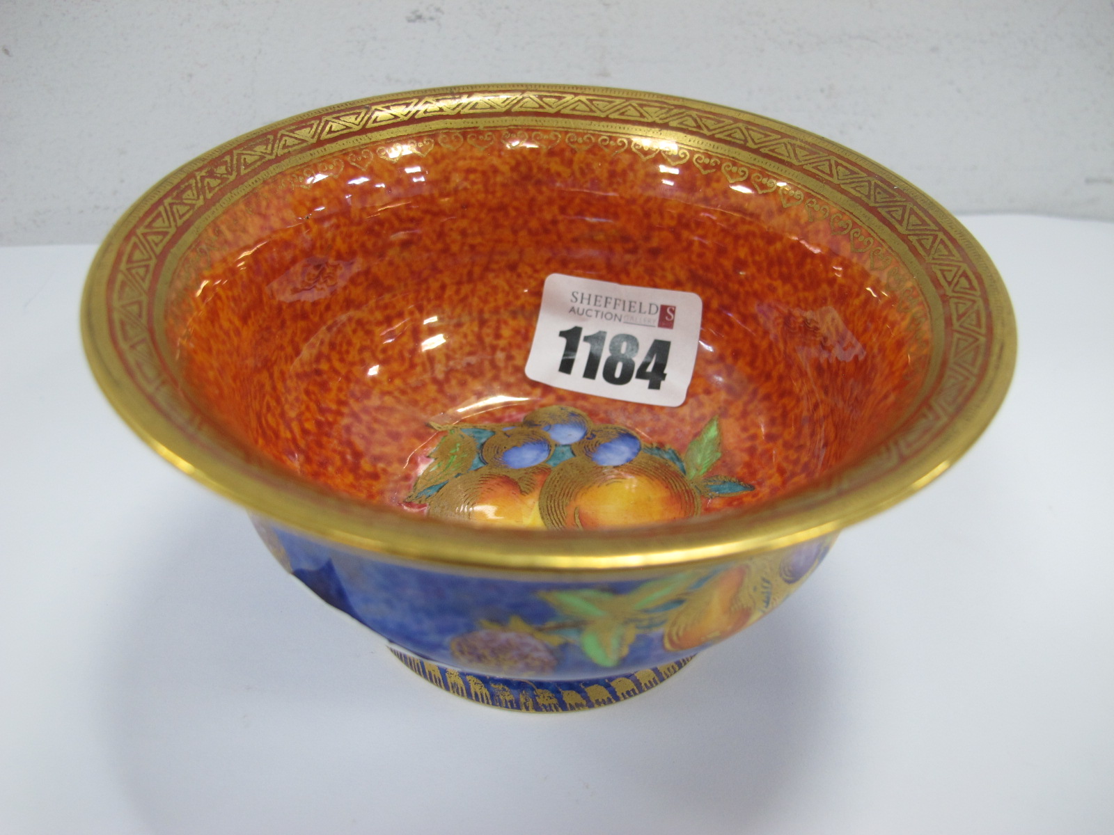 Daisy Makeig Jones Designed for Wedgwood, Pedestal Bowl, with fruit design to orange speckled lustre