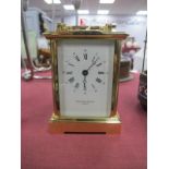 A Carriage Clock for Taylor and Bligh, London, 11.5cm high with handle down.