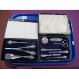 A Hallmarked Silver Handled Manicure Set, each with scroll engraved decoration, including