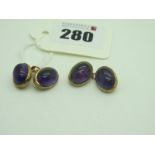 A Pair of 9ct Gold Amethyst Cufflinks, oval cabochon collet set, on chain connections.