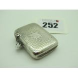 A Hallmarked Silver Vesta Case, allover engine turned decoration with vacant cartouche and