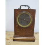 A Mid Victorian Mahogany Inlaid Mantle Clock, with carrying handle, the circular silvered dial