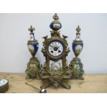 A Late XIX Century French Clock Garniture, the elaborate gilt metal cases inset with porcelain